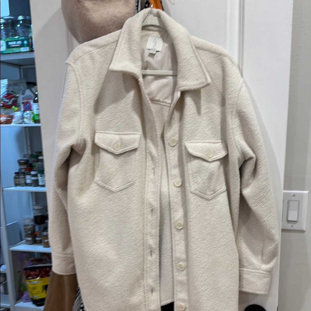 Cream Utility Jacket with Prominent Collar and Textured Fabric